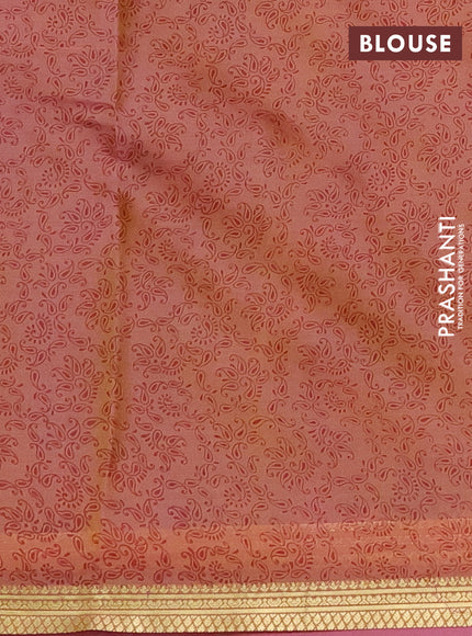 Printed silk saree pastel peach and peach pink with allover prints and zari woven border