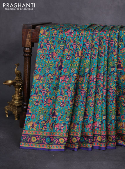 Printed silk saree teal green and blue with allover kalamkari prints and printed border