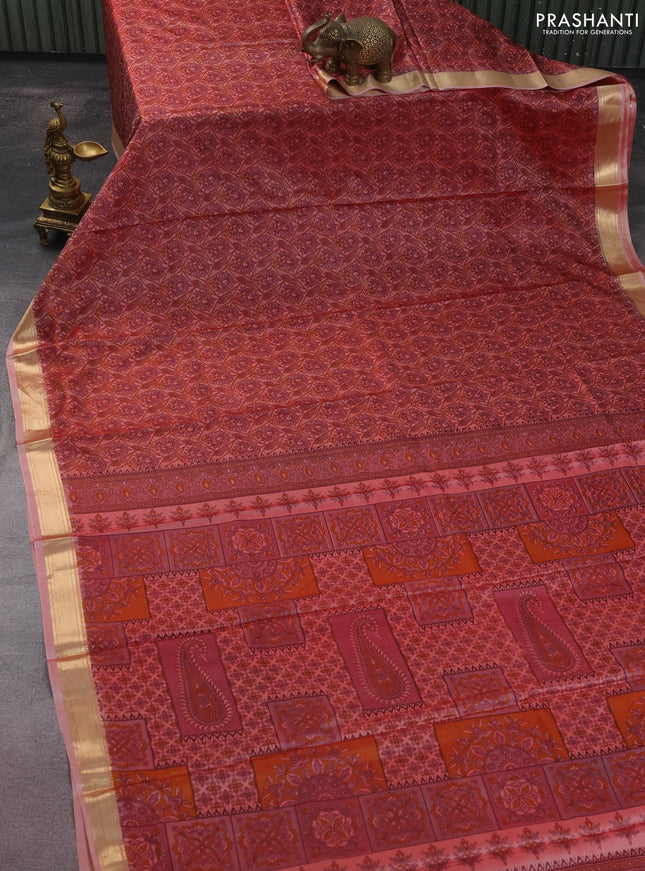 Printed silk saree dual shade of pastel peach with allover prints and zari woven border