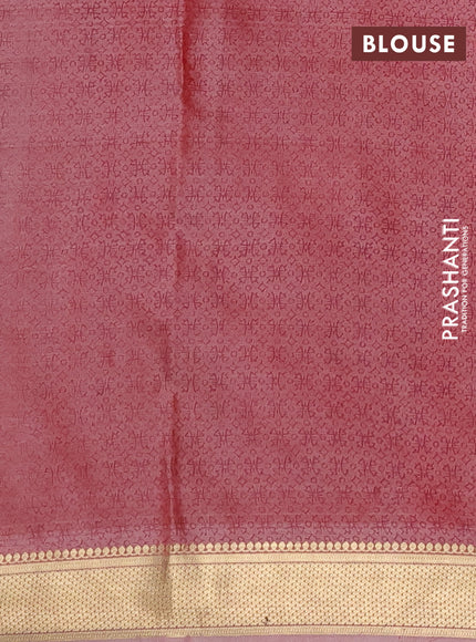 Printed silk saree dual shade of pastel peach with allover prints and zari woven border