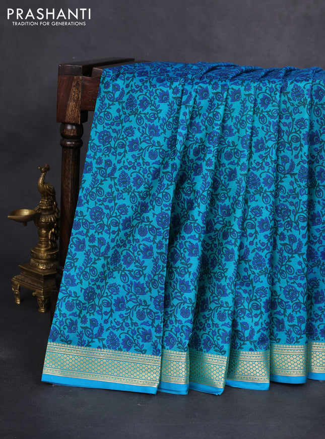 Printed silk saree teal blue with allover prints and zari woven border