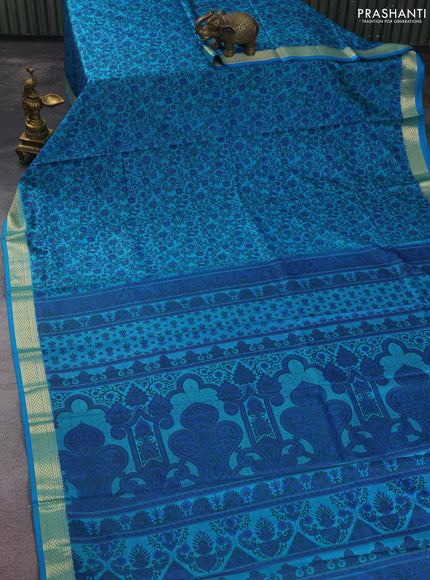 Printed silk saree teal blue with allover prints and zari woven border