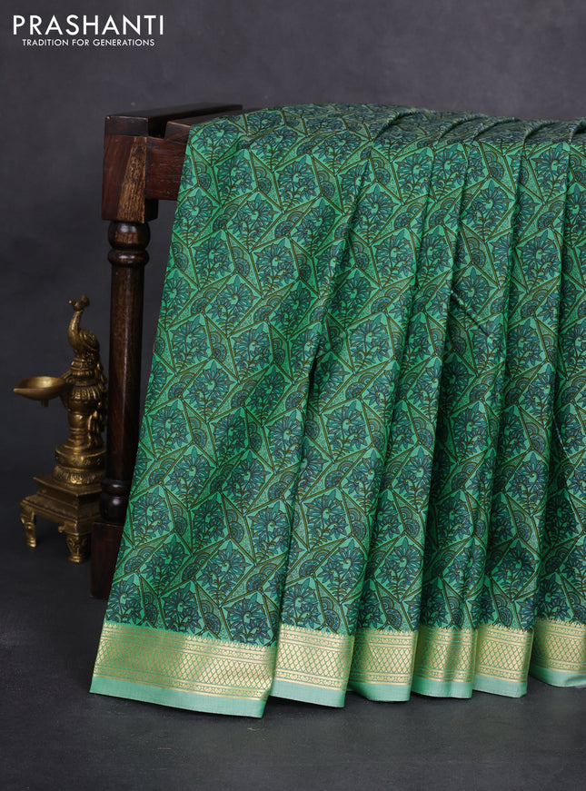 Printed silk saree pastel green with allover prints and zari woven border