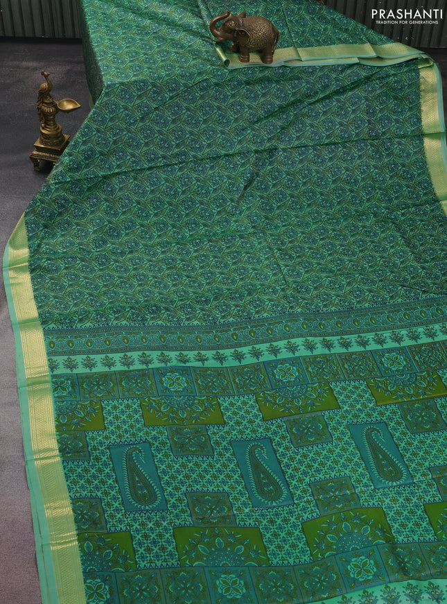Printed silk saree pastel green with allover prints and zari woven border