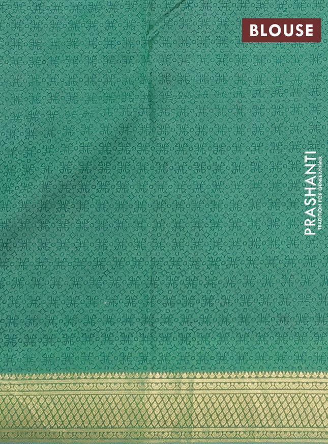 Printed silk saree pastel green with allover prints and zari woven border