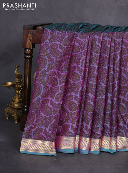 Printed silk saree dual shade of purple and teal green with allover paisley prints and zari woven border