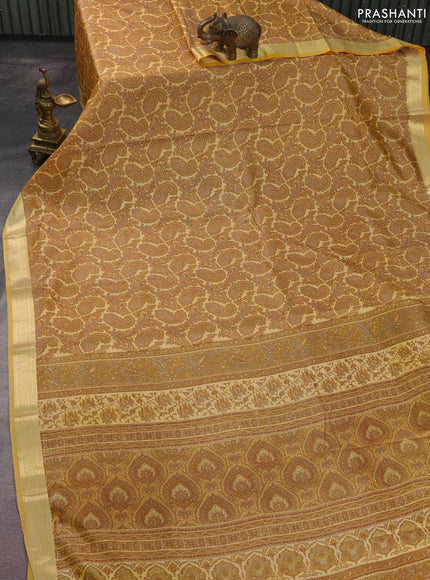 Printed silk saree pale yellow with allover paisley prints and zari woven border
