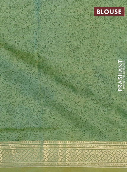 Printed silk saree dual shade of pastel green with allover paisley prints and zari woven border