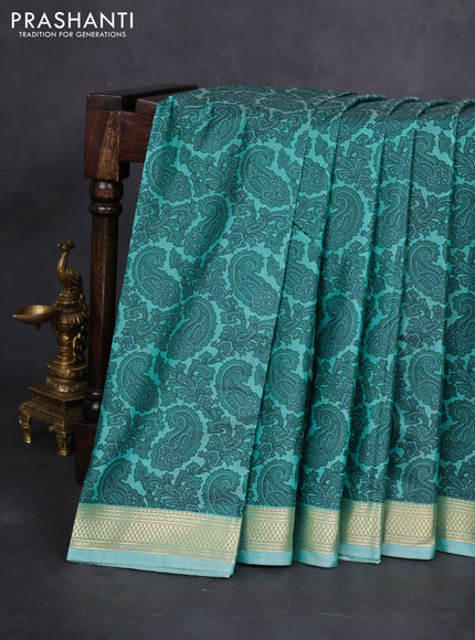 Printed silk saree teal blue shade with allover paisley prints and zari woven border