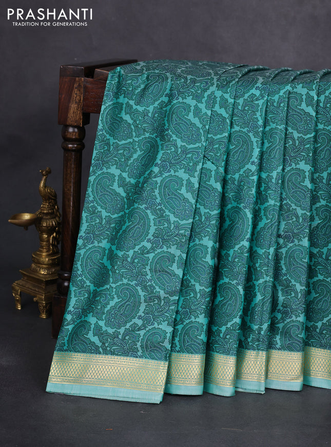 Printed silk saree teal blue shade with allover paisley prints and zari woven border