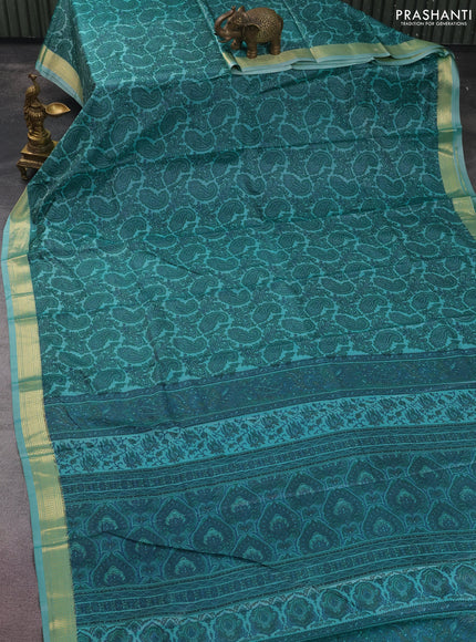Printed silk saree teal blue shade with allover paisley prints and zari woven border