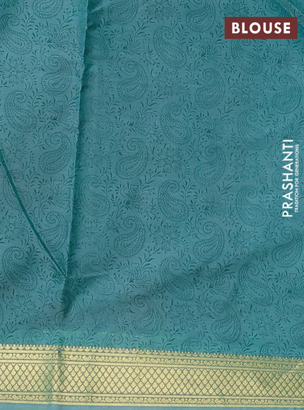 Printed silk saree teal blue shade with allover paisley prints and zari woven border