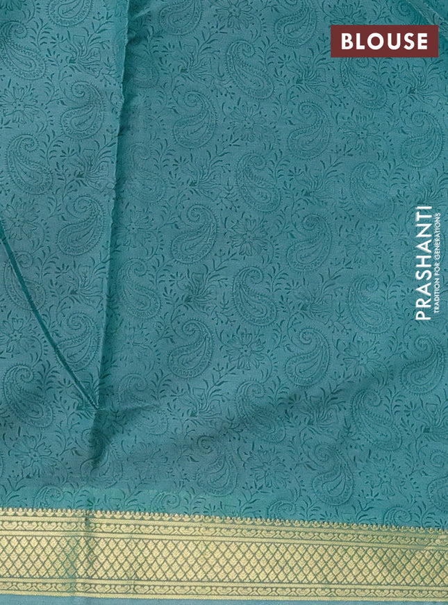 Printed silk saree teal blue shade with allover paisley prints and zari woven border