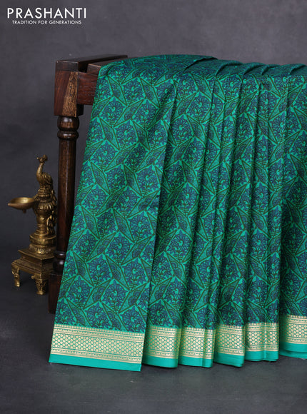 Printed silk saree green with allover prints and zari woven border