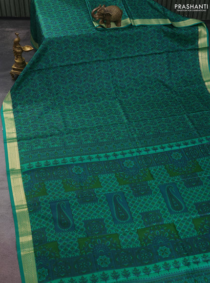 Printed silk saree green with allover prints and zari woven border