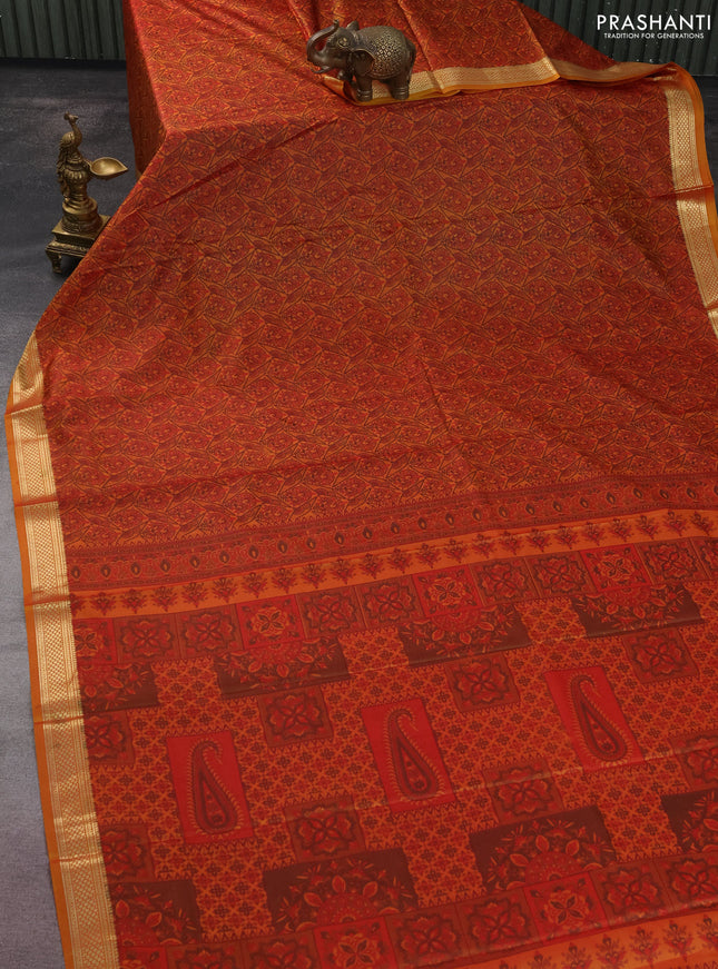 Printed silk saree dark mustard with allover prints and zari woven border