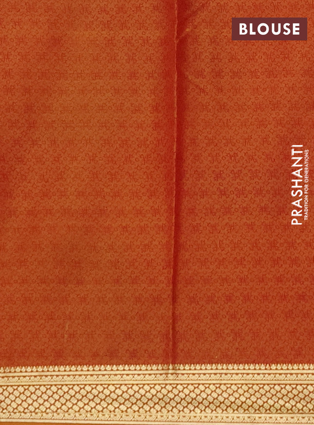 Printed silk saree dark mustard with allover prints and zari woven border