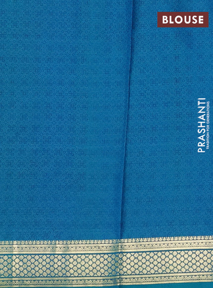 Printed silk saree teal green and blue with allover prints and zari woven border