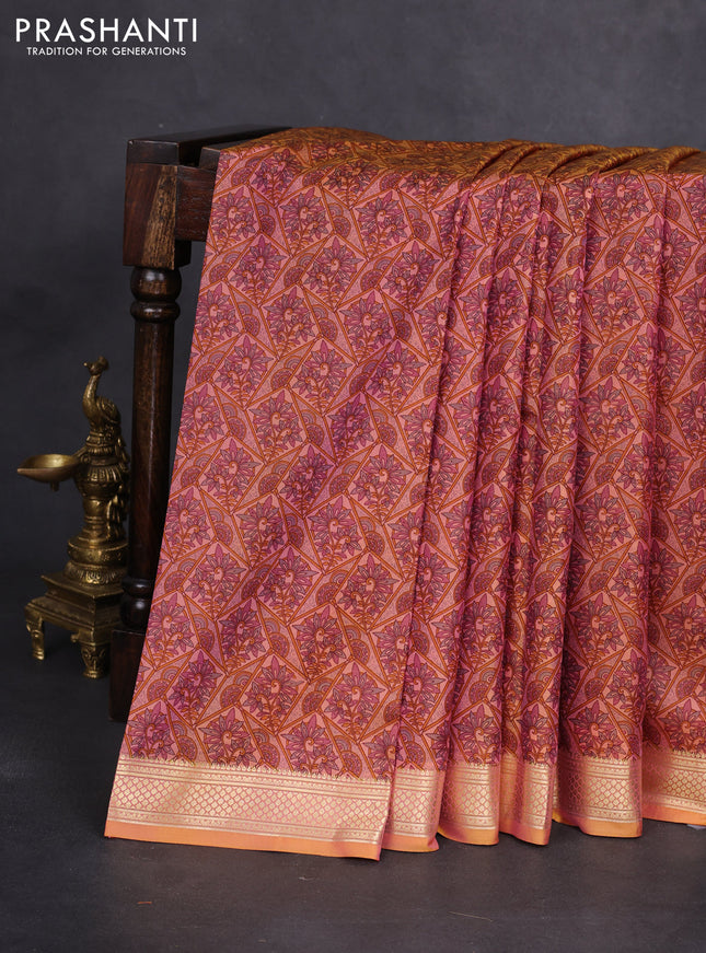 Printed silk saree dual shade of peach orange with allover prints and zari woven border