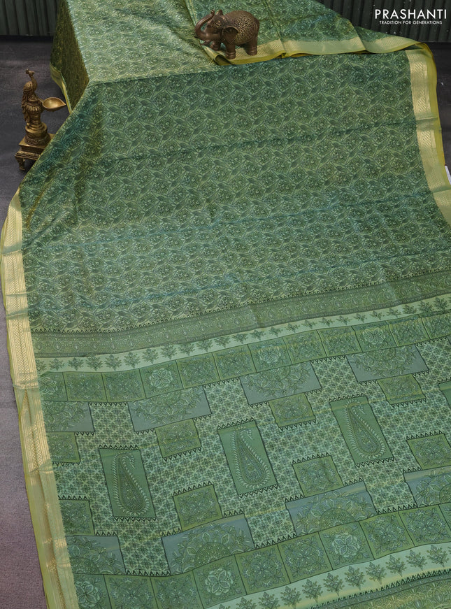 Printed silk saree pastel green with allover prints and zari woven border