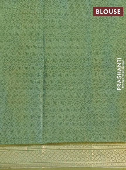 Printed silk saree pastel green with allover prints and zari woven border