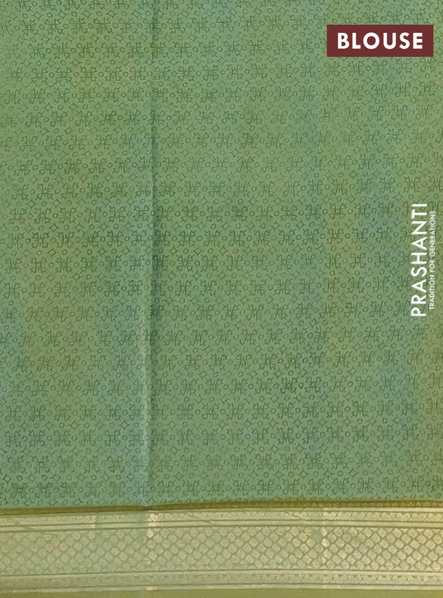 Printed silk saree pastel green with allover prints and zari woven border