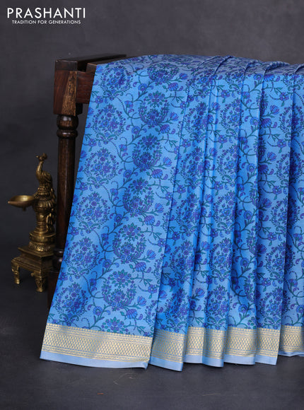 Printed silk saree pastel blue with allover prints and zari woven border