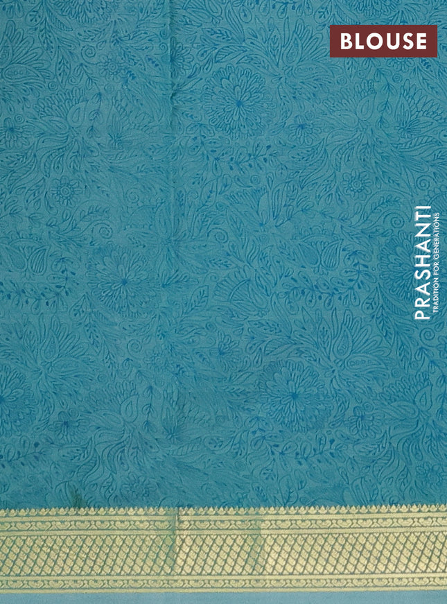 Printed silk saree pastel green shade with allover prints and zari woven border