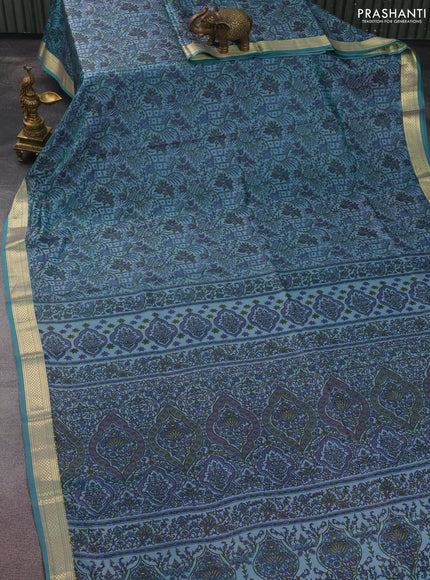Printed silk saree teal blue with allover prints and zari woven border