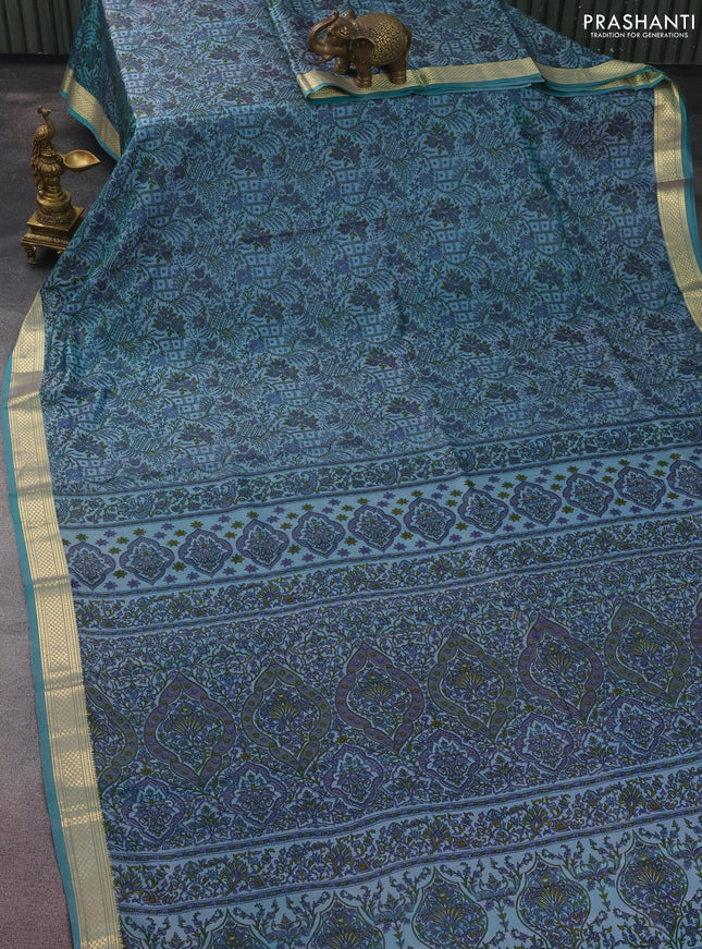 Printed silk saree teal blue with allover prints and zari woven border
