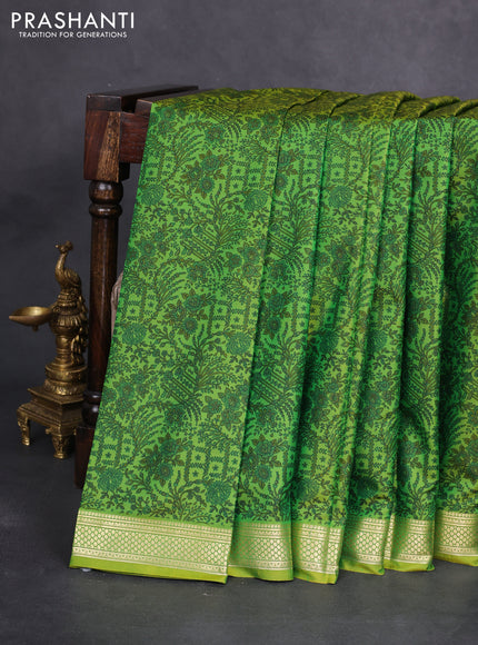 Printed silk saree light green with allover prints and zari woven border