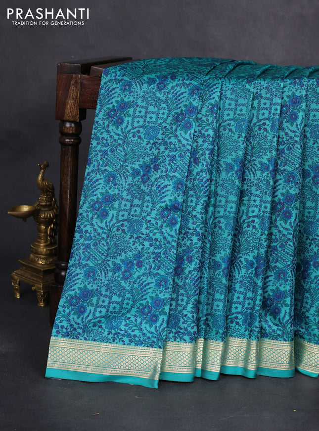 Printed silk saree teal blue with allover prints and zari woven border