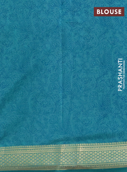 Printed silk saree teal blue with allover prints and zari woven border
