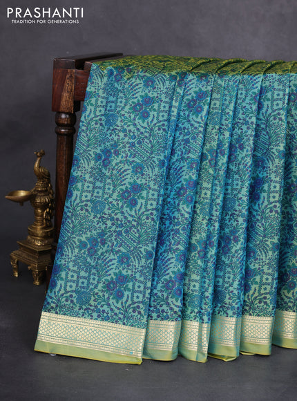 Printed silk saree dual shade of green with allover prints and zari woven border