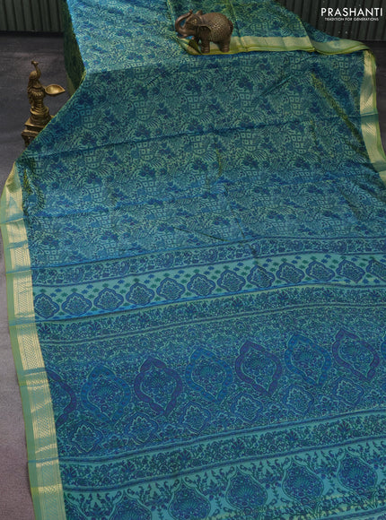 Printed silk saree dual shade of green with allover prints and zari woven border