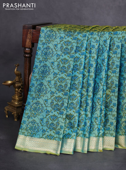 Printed silk saree dual shade of greenish blue with allover prints and zari woven border