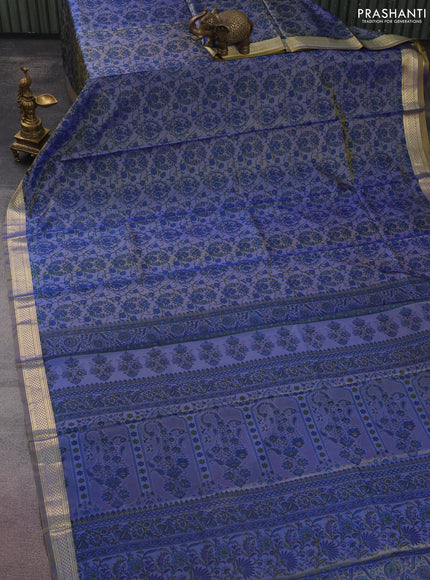 Printed silk saree dual shade of bluish yellow with allover prints and zari woven border