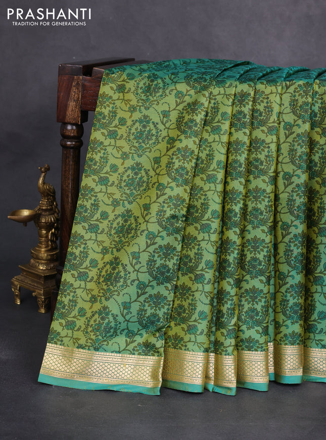 Printed silk saree dual shade of teal green with allover prints and zari woven border