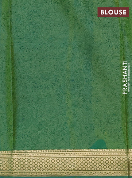 Printed silk saree dual shade of teal green with allover prints and zari woven border