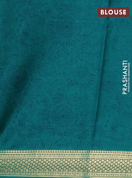 Printed silk saree teal green with allover prints and zari woven border
