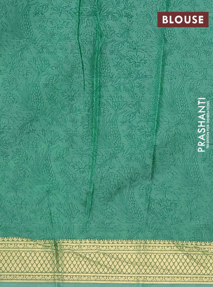 Printed silk saree teal green shade with allover prints and zari woven border