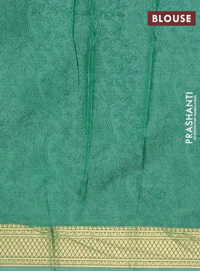 Printed silk saree teal green shade with allover prints and zari woven border