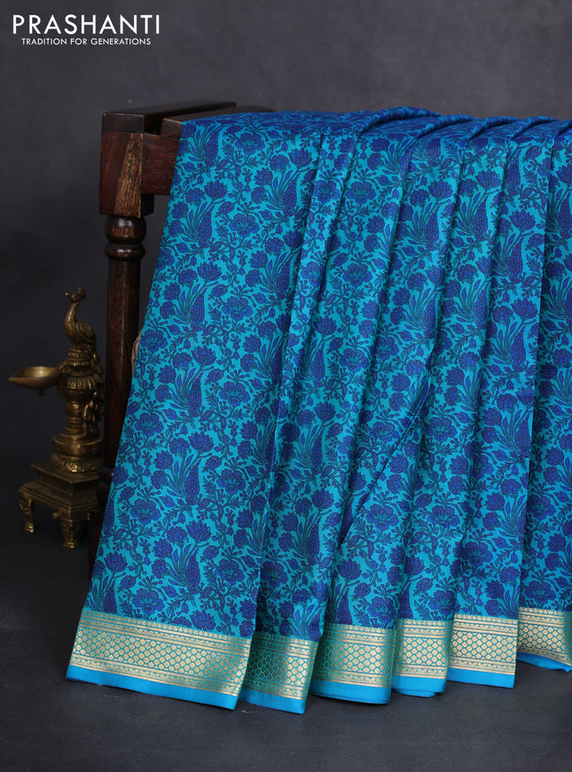 Printed silk saree teal blue with allover prints and zari woven border
