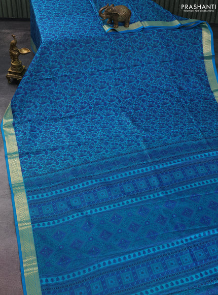 Printed silk saree teal blue with allover prints and zari woven border