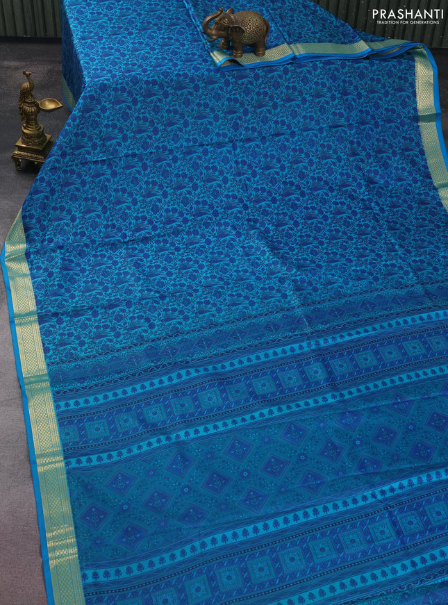 Printed silk saree teal blue with allover prints and zari woven border