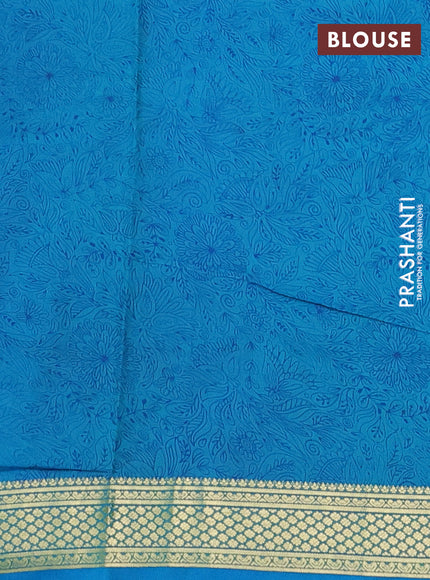 Printed silk saree teal blue with allover prints and zari woven border