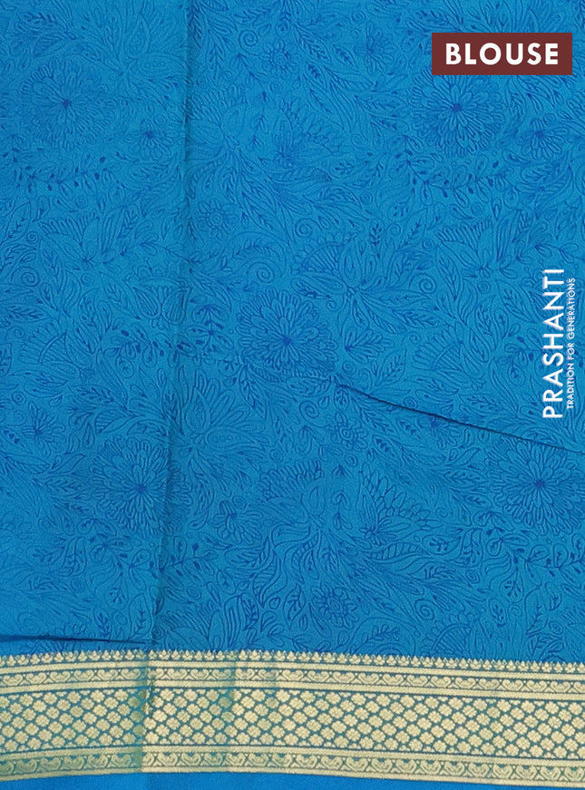 Printed silk saree teal blue with allover prints and zari woven border