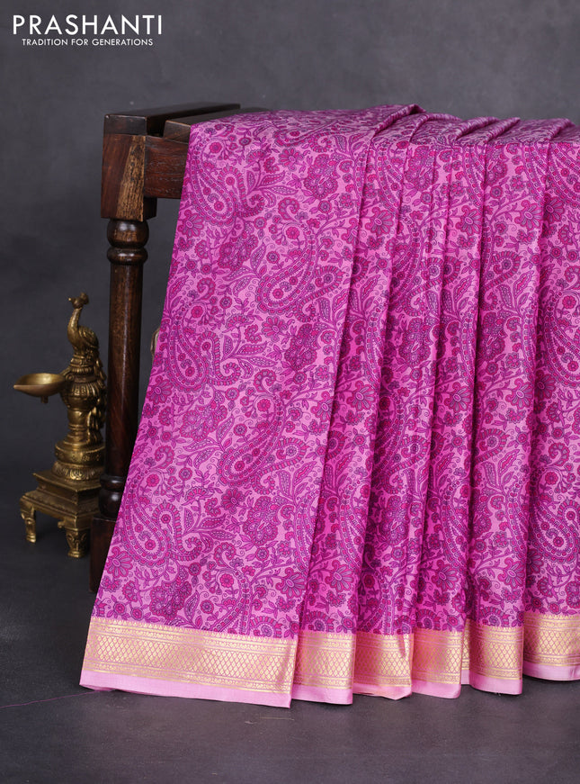 Printed silk saree light pink and pink with allover prints and zari woven border