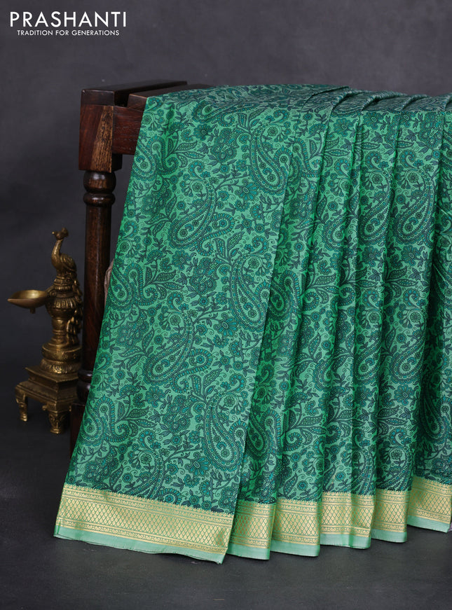 Printed silk saree pastel green with allover prints and zari woven border