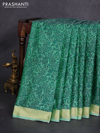 Printed silk saree pastel green with allover prints and zari woven border